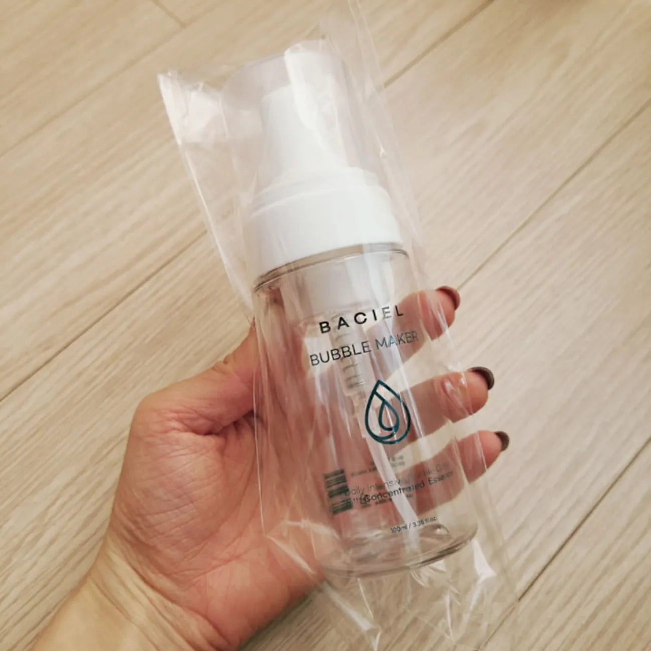 Hand-held view of BACIEL Bubble Maker showing compact size and daily usability